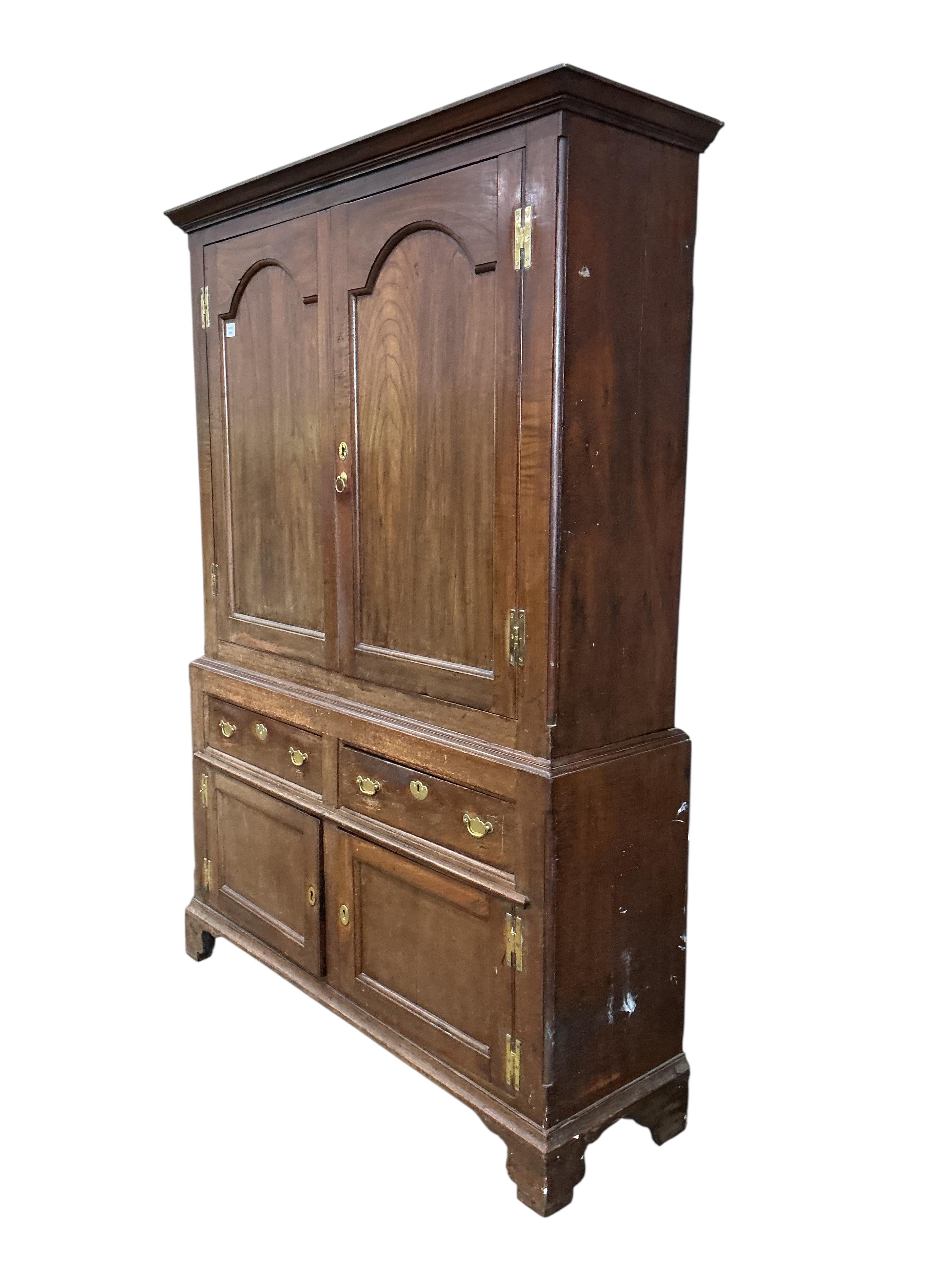 A George III fruitwood press cupboard, width 144cm, depth 41cm, height 204cm